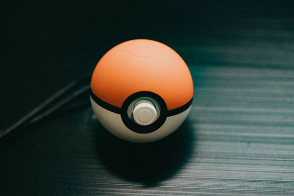 Poke ball sits on a table.