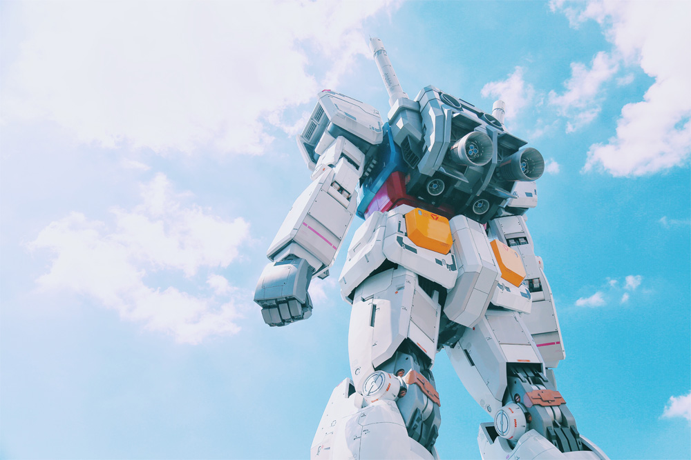 gundam model with clouds in the sky