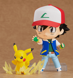 Chibi-style Ash and Pikachu figurines in a battle pose. 