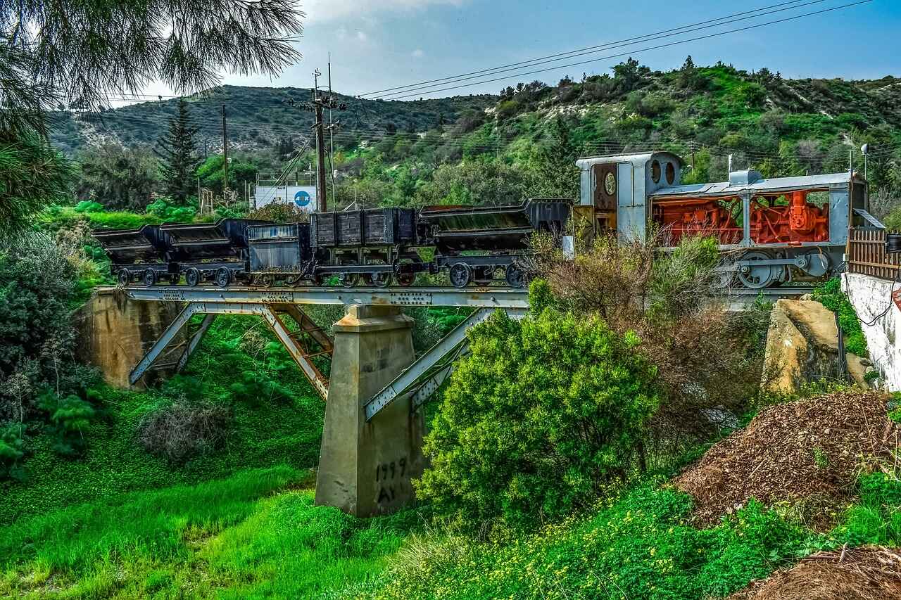 Mining train crossing a bridge in the mountains.