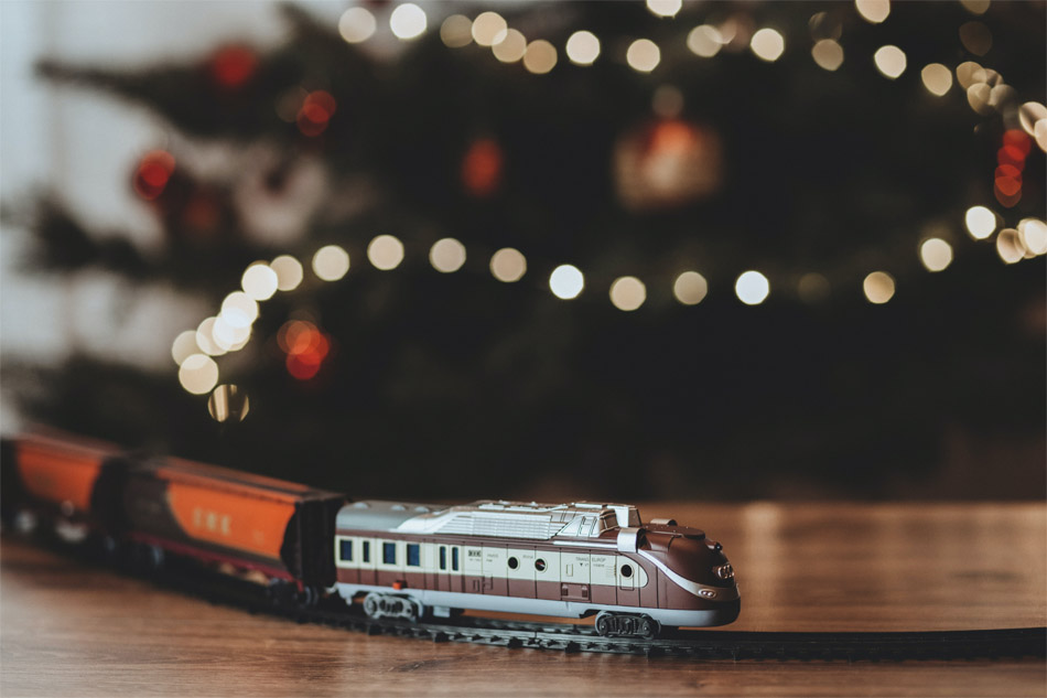 A photo displaying a modern model train on a track.