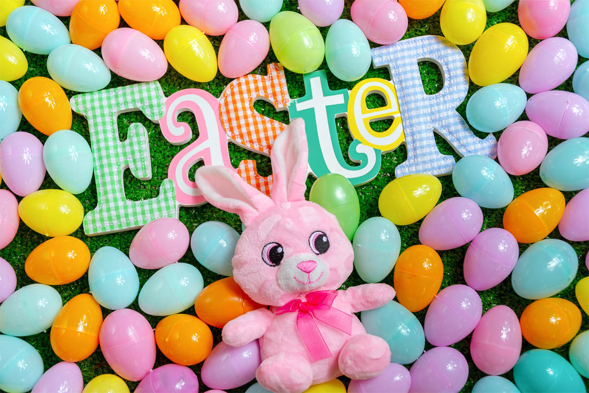 pink plush toy with colorful Easter eggs