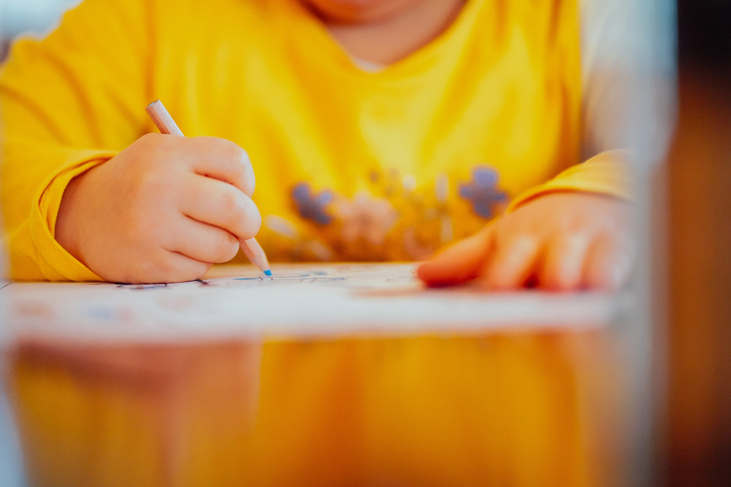 A child drawing with arts and crafts train gifts